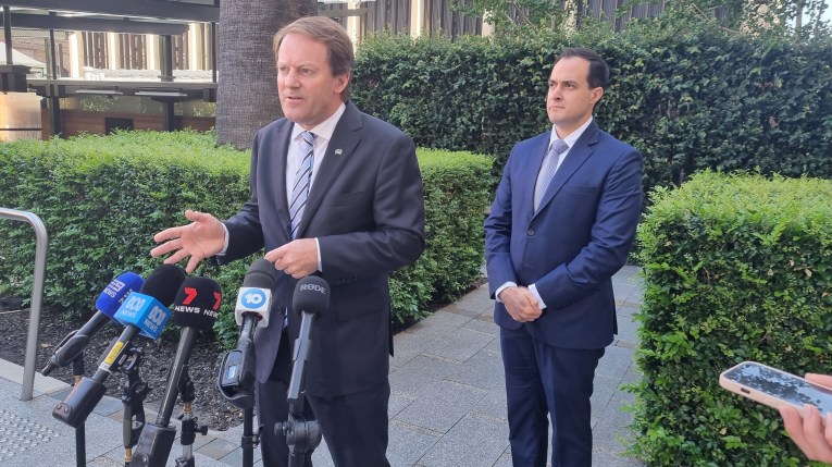 Josh Teague and Vincent Tarzia holding a press conference. 