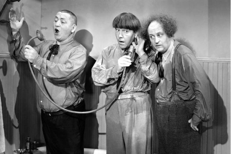 A still from black and white television show, The Three Stooges.