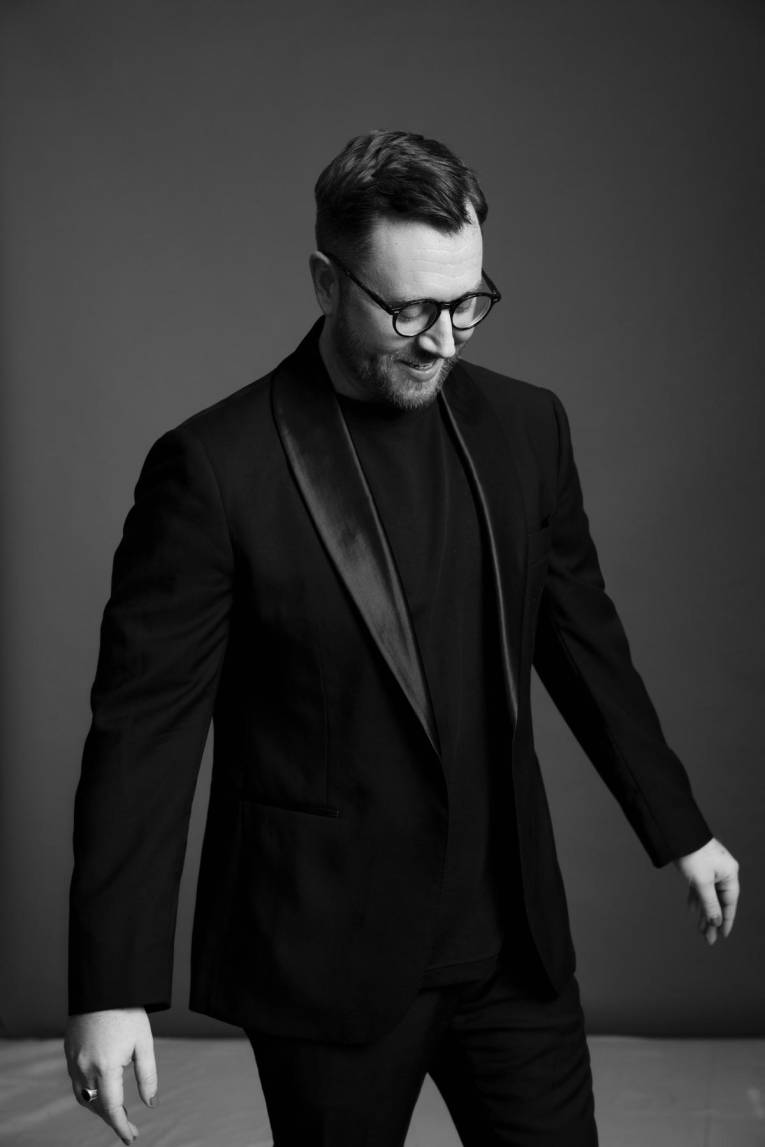 Black and white studio photo of a person