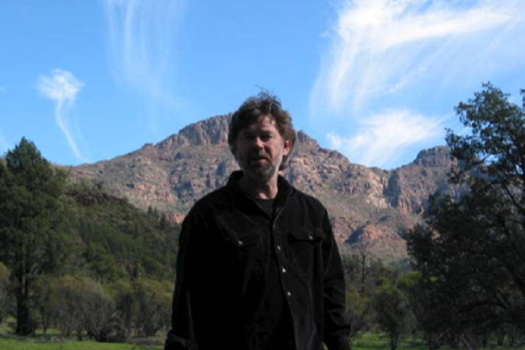 John Schumann against St Marys Peak, Flinders Ranges at the time of the protests