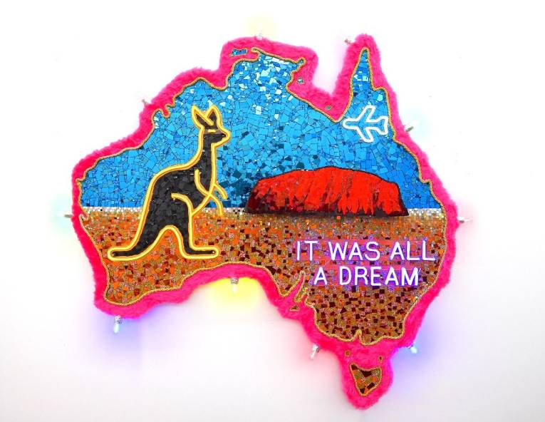 Artwork by Paul Yore, Uluru (It Was All A Dream), 2025, mixed media assemblage on board comprising glass, plastic, beads, synthetic fur, trim, cotton thread, LED light, wood, synthetic polymer, adhesive, and fixtures, 185 x 174 x 13 cm