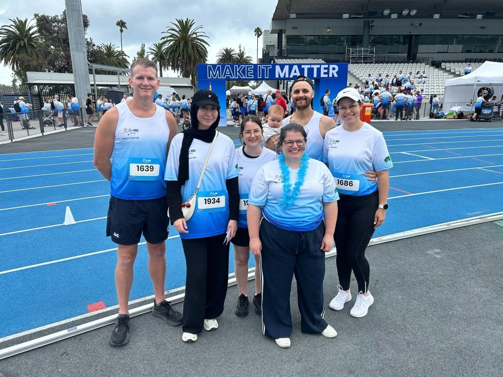 Professor Zachary Munn (L) and HESRI colleagues at an MND fundraising event