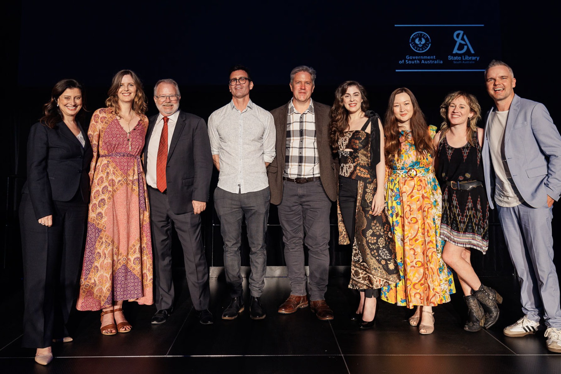 Premier's Award winner Shannon Burns (fourth from left) with Arts Minister Andrea Michaels, State Library director Geoff Strempel, and other winners in the 2024 South Australian Literary Awards. Photo: James Field Photography