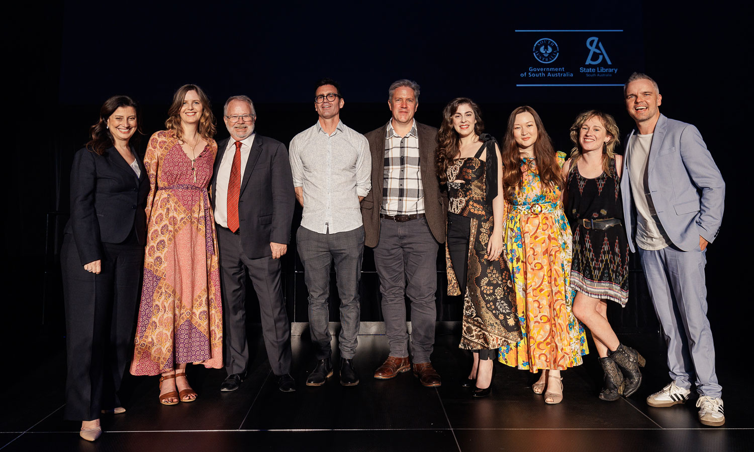 Premier's Award winner Shannon Burns (fourth from left) with Arts Minister Andrea Michaels, State Library director Geoff Strempel, and other winners in the 2024 South Australian Literary Awards. Photo: James Field Photography
