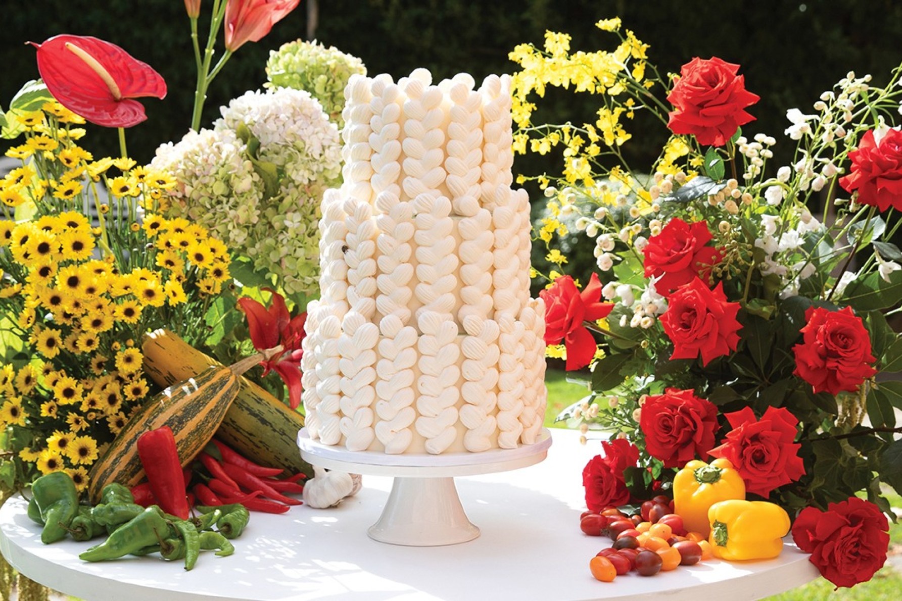 Cristina Tridente's neutral-toned bridal shower cake amongst the many pops of colours.