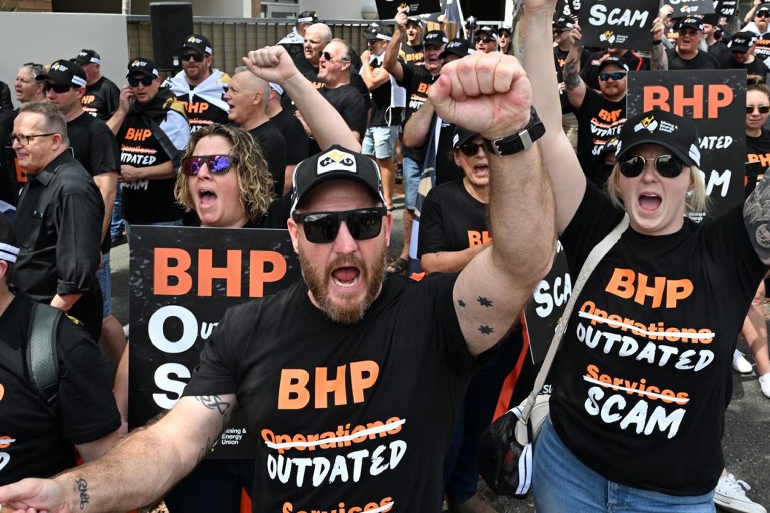 Union members protest at BHP's AGM in Brisbane as they fight the company over its use of labour hire firms. Photo: Darren England/AAP 