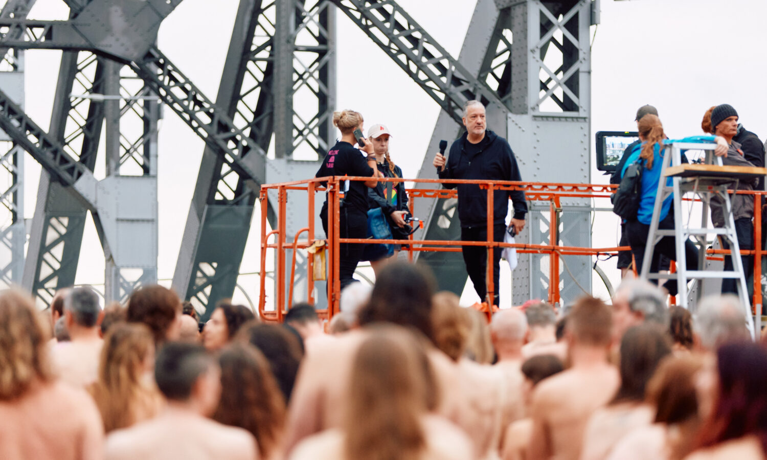 Spencer Tunick directs his latest mass nude photo shoot on the Story Bridge on Sunday. October 27. Photo: Markus Ravik