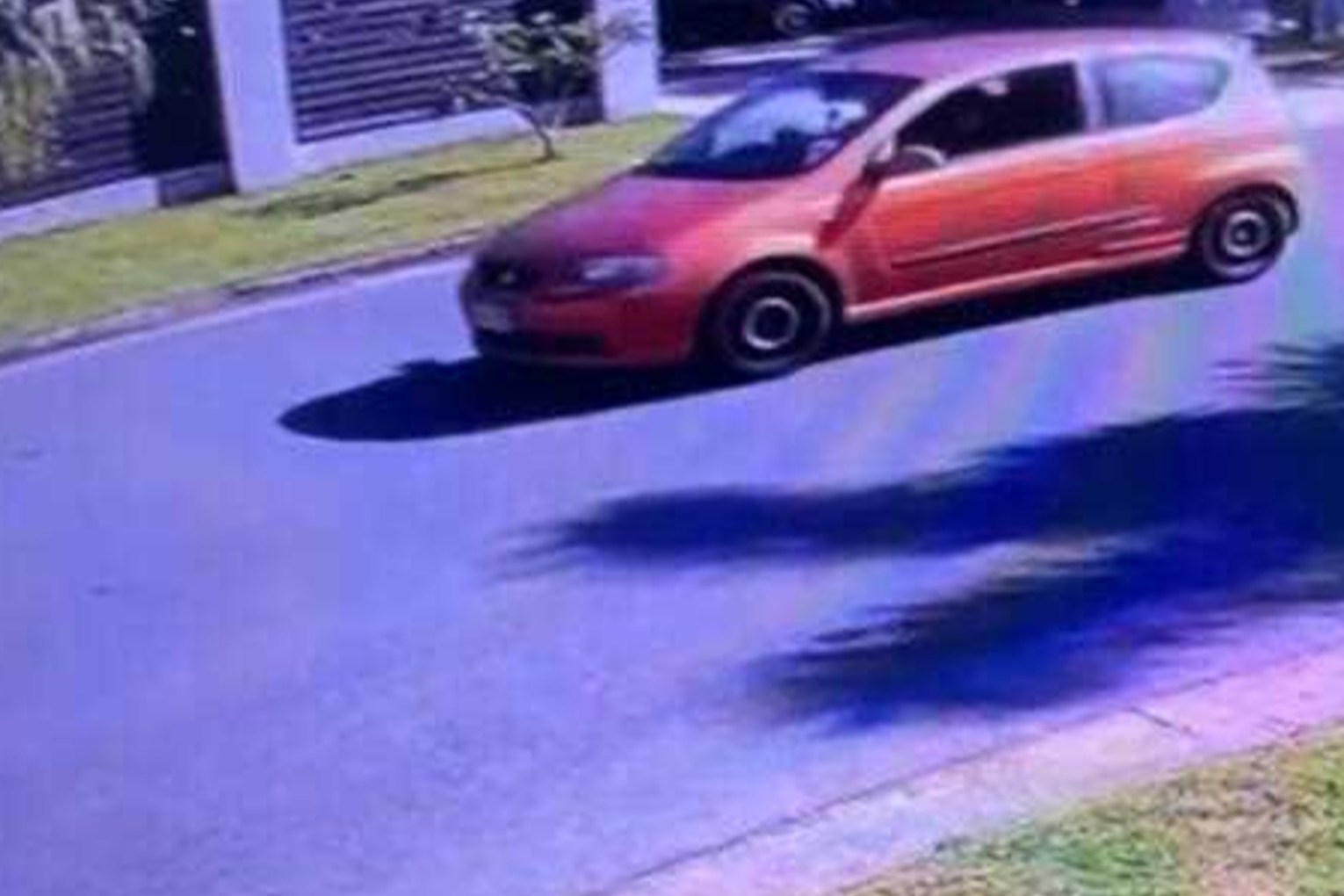 Police allege a 21-year-old man was one of three people in a stolen orange Holden hatchback. Photo: Queensland Police