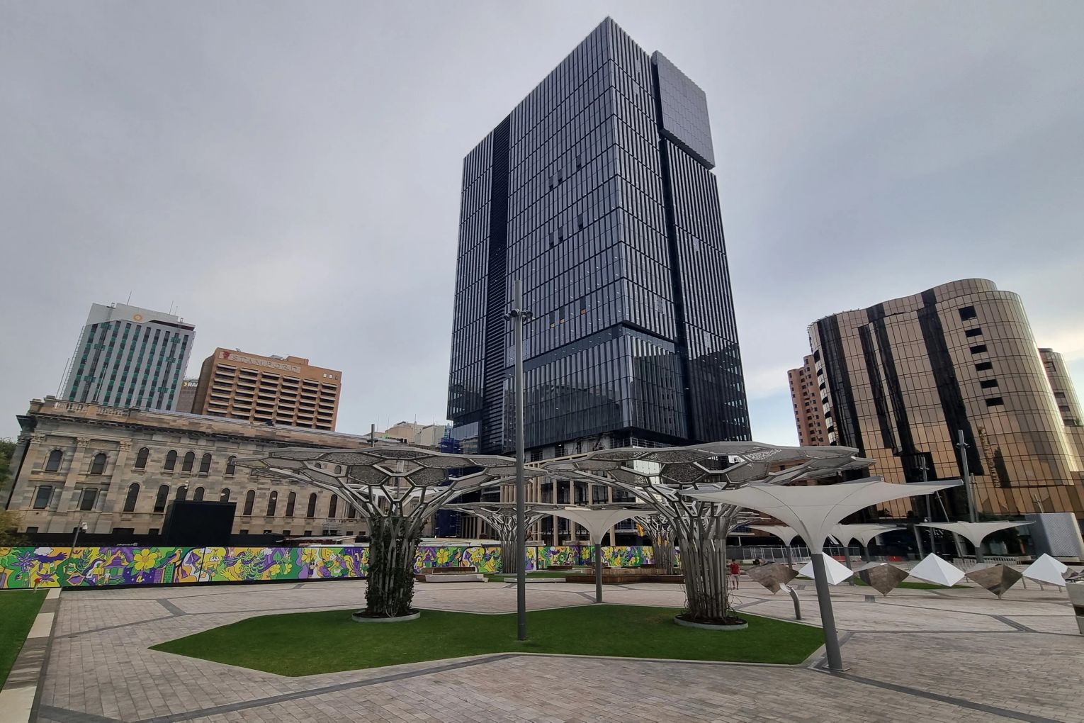 The Malinauskas Government says developer Walker Corporation will build a 38-storey tower to the left of its existing tower on Festival Plaza, behind Parliament House. Picture: Thomas Kelsall/InDaily