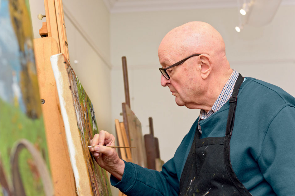 William Robinson at work - the artist's paintings have inspired a fusion of ballet and music in Soiree, showcasing dancers from the Queensland Ballet Academy.