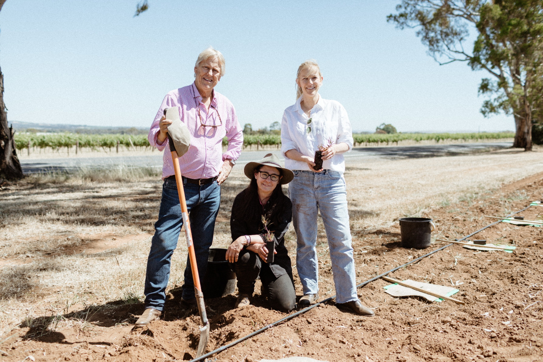 Robert Hill-Smith, Louisa Rose and Jessica Hill-Smith planting trees at the Yalumba Signature Vineyard. Photo: supplied