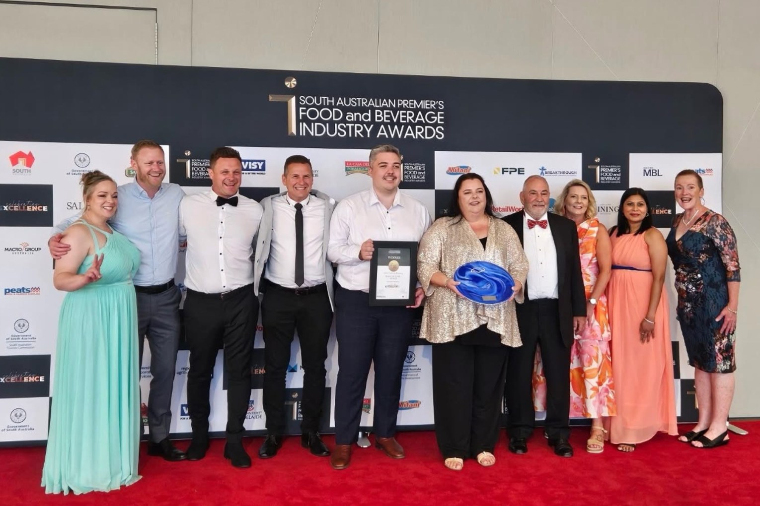 The team from Villis celebrate being inducted into the Food SA Hall of Fame. Photo: Food SA