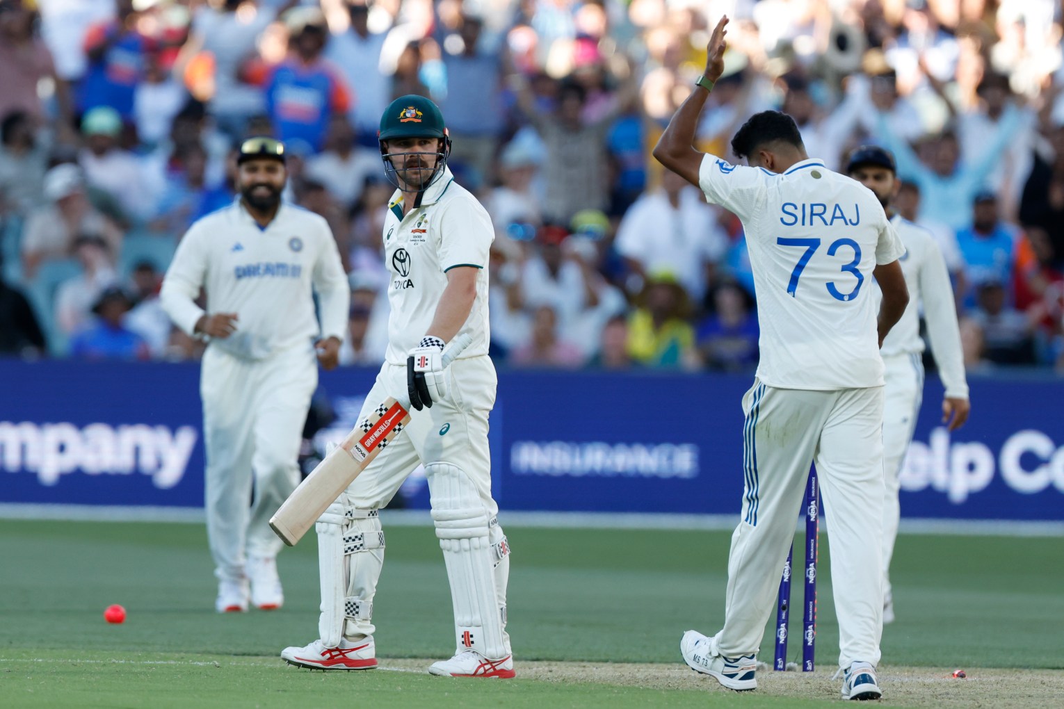 Mohammed Siraj and Travis Head have been sanctioned for this exchange during the second Test in Adelaide. Photo: James Elsby/AAP