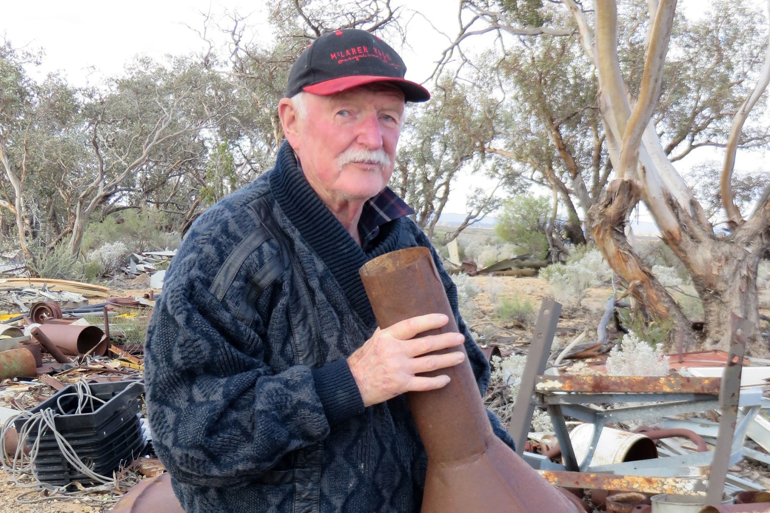 Geoff Wilson with found object, Wirrealpa Station, 2013 . Photo: John Neylon 