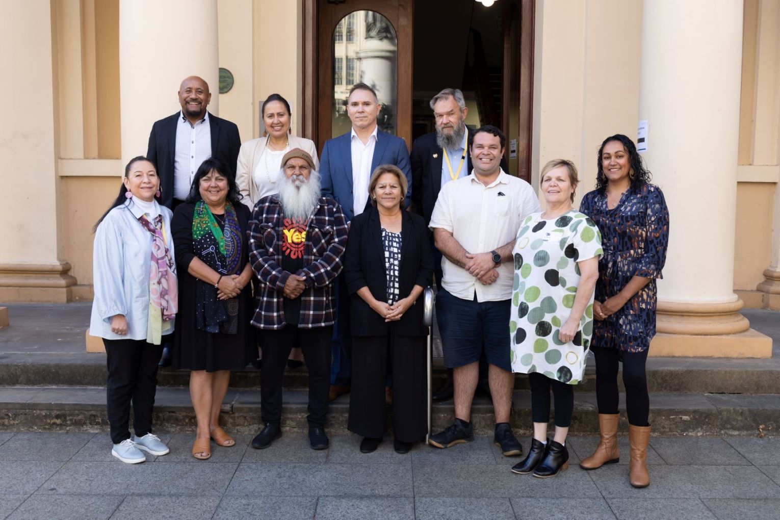 Deb Moyle (bottom row second from right) with members of the Central Voice. Top row (L-R) Tony Minniecon, April Lawrie, Robert Leidig, Scott Wilson. Bottom row:  Susan Dixon, Cheryl Axleby, Moogy Sumner, Rosalind Coleman, Douglas Clinch, Deb Moyle, Tahlia Wanganeen. Photo: First Nations Voice/supplied