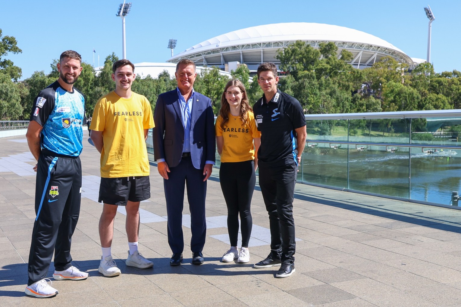 Strikers Captain Matt Short, diploma student Samuel, Vice-Chancellor Professor Colin Stirling, Diploma student Olivia and Head Coach Tim Paine. Photo: Supplied.