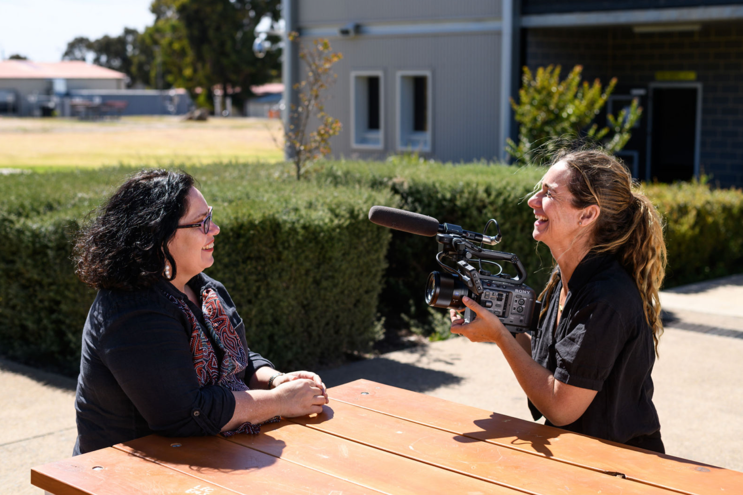 Singer/songwriter Nancy Bates and filmmaker Shalom Almond inside the Adelaide Women's Prison.
