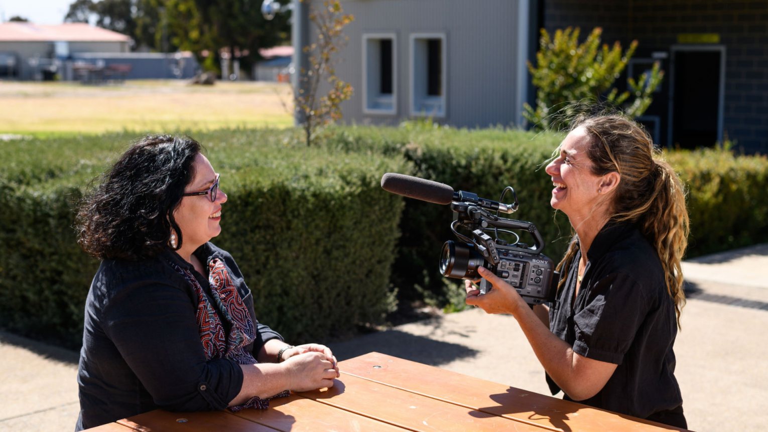 Singer/songwriter Nancy Bates and filmmaker Shalom Almond inside the Adelaide Women's Prison.