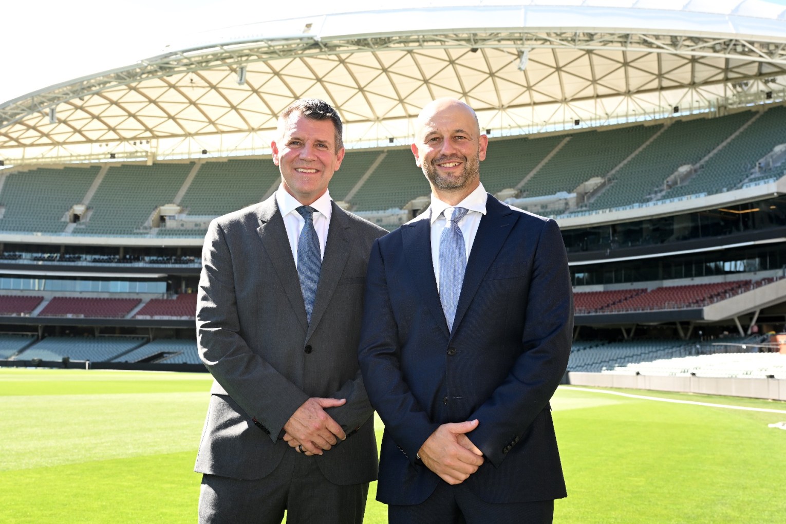 Cricket Australia chair Mike Baird (left) poses with newly-appointed CEO Todd Greenberg in Adelaide. Photo: Dave Hunt/AAP.