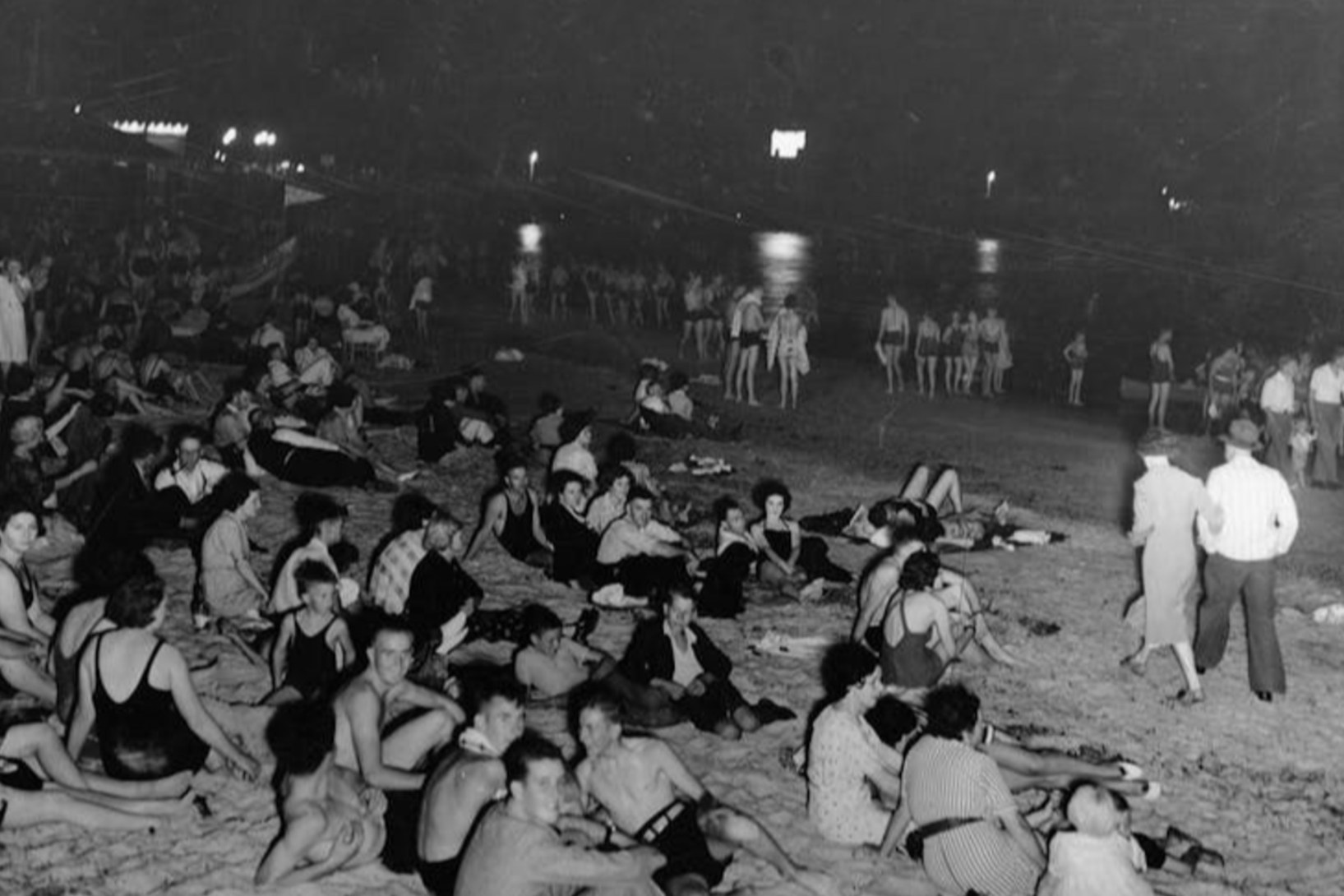 A beach in Glenelg, South Australia is packed during an evening in February 1938. State Library of South Australia