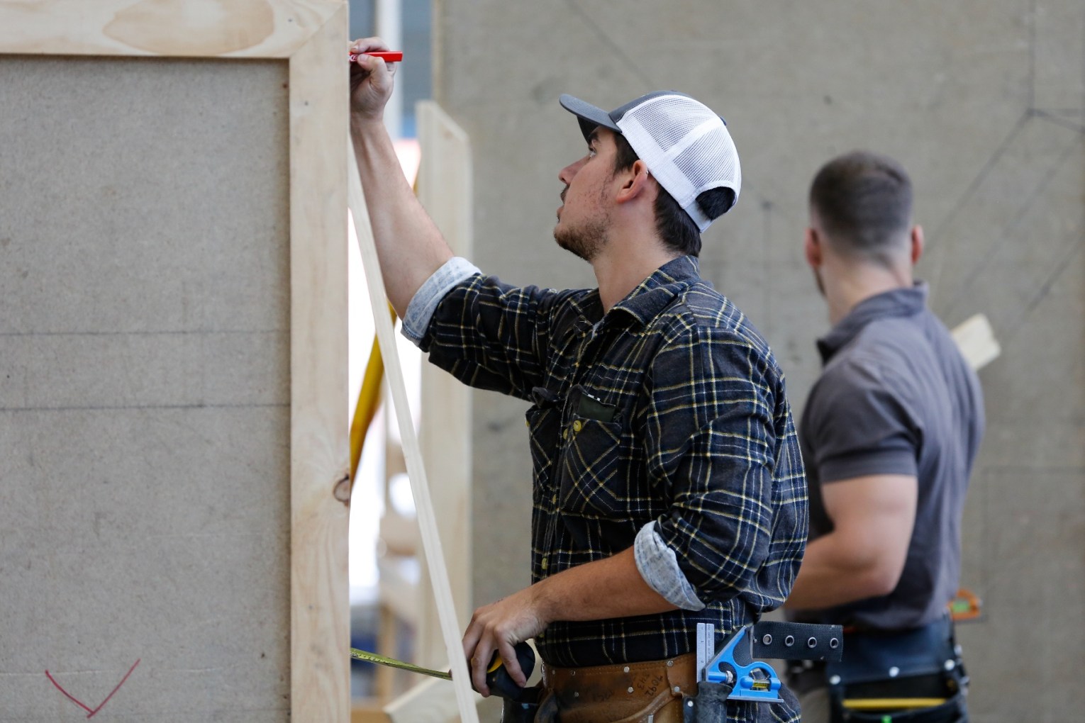 The prime minister will unveil increased allowances in a bid to keep apprentices in their trade. Photo: AAP