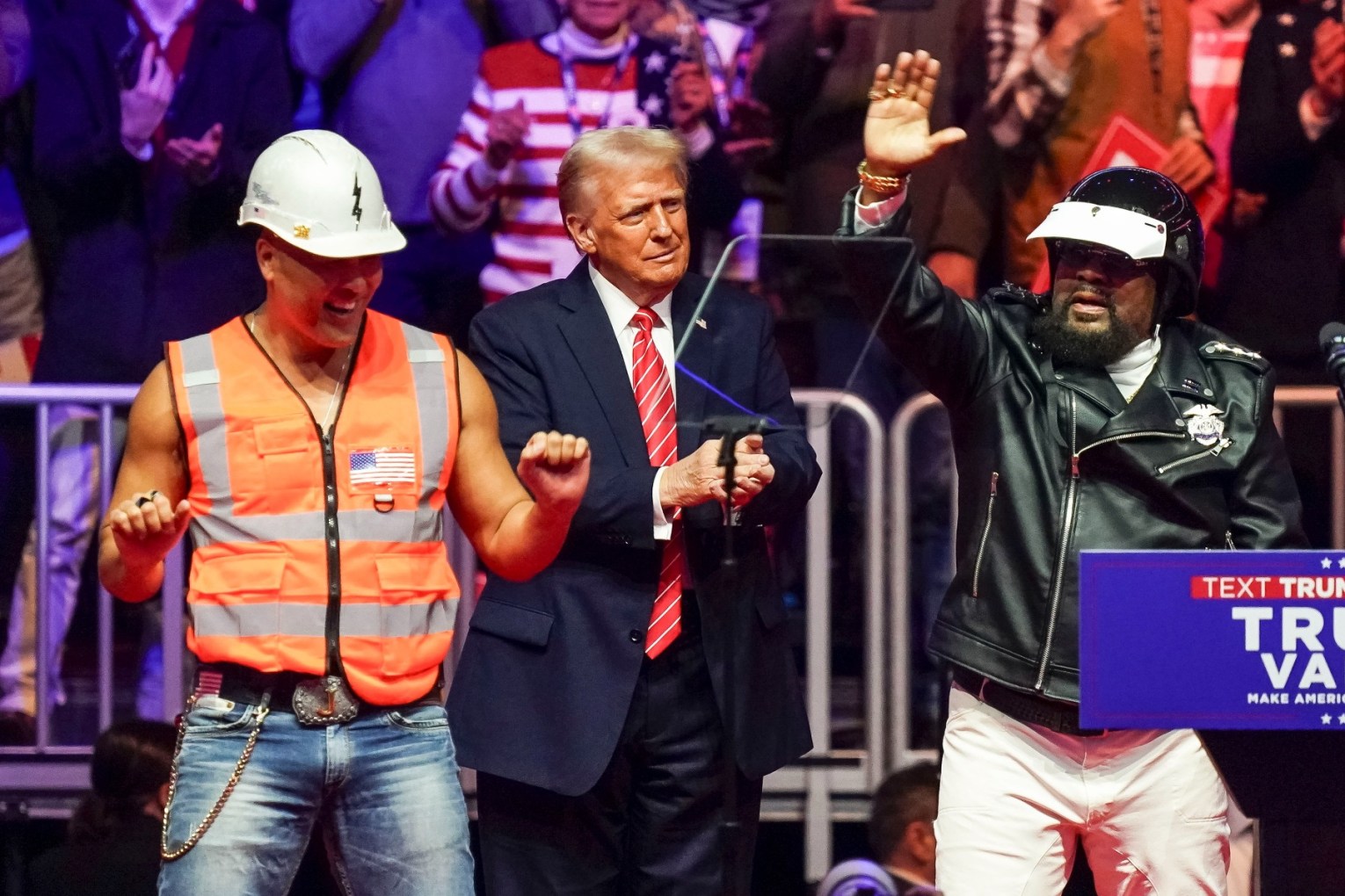 Trump dances on stage with the Village People at his rally.