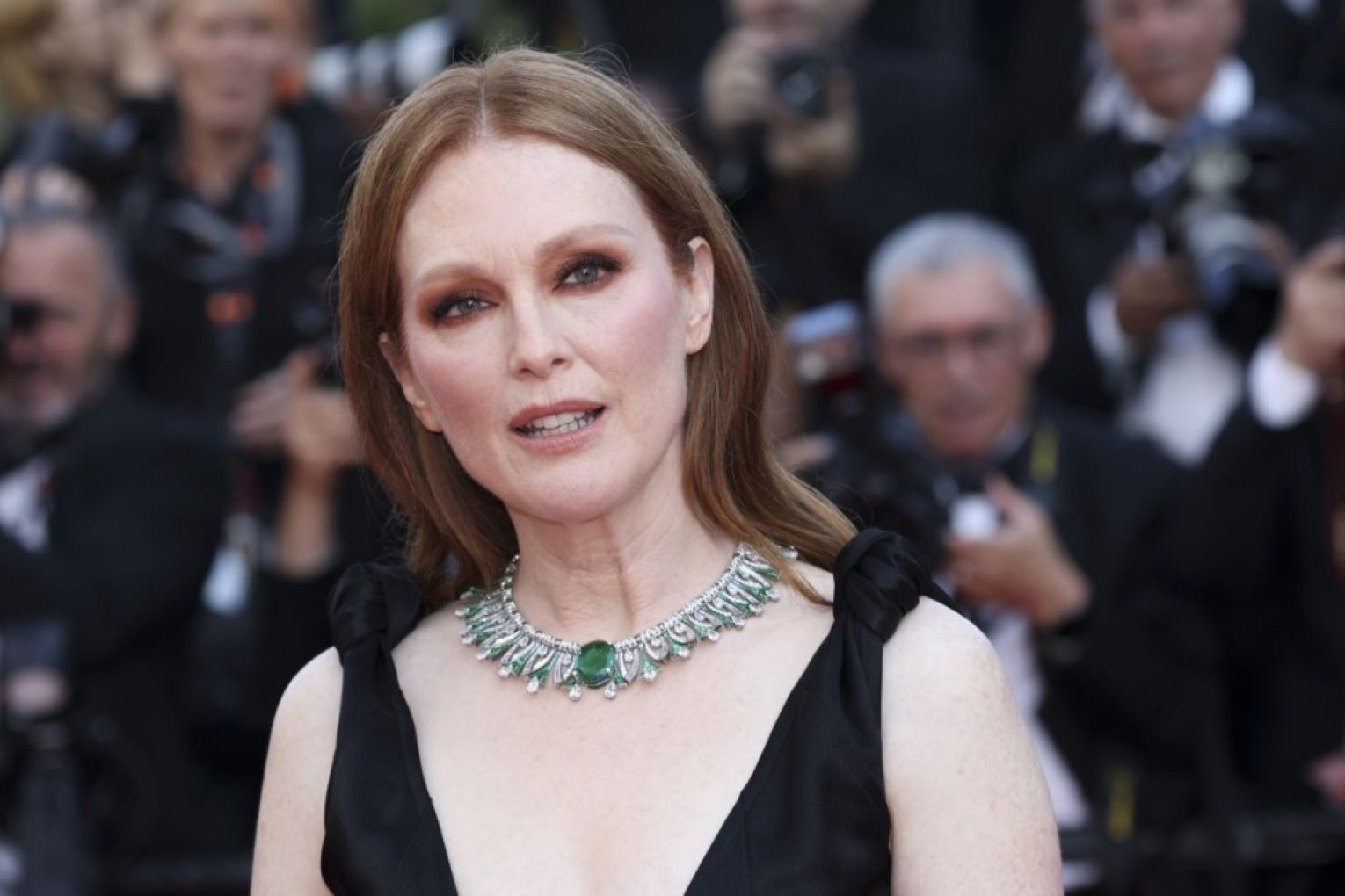Julianne Moore says she is "truly saddened" by a Trump administration ban on her children's book. 