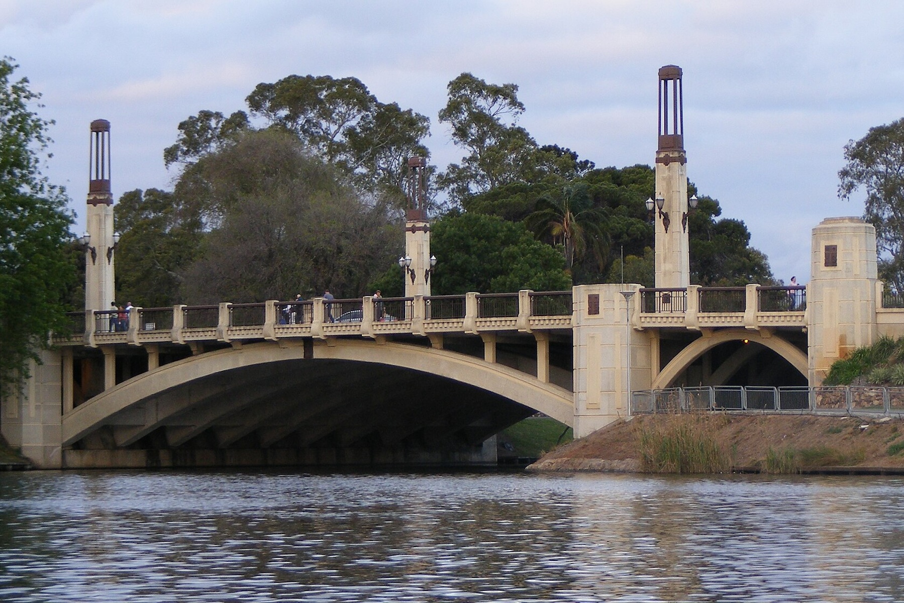 Poem: I am sitting on the edge of a bridge