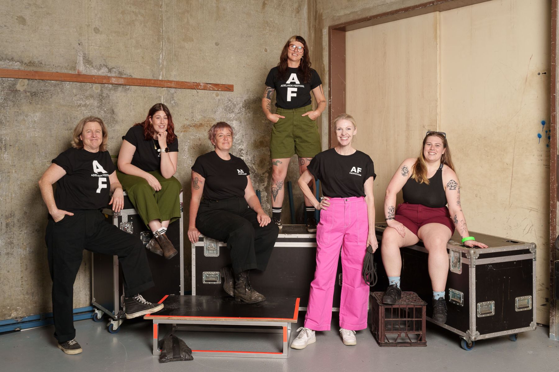 The festival production team decked out in their colourful SUK workwear. Pictures: Andrew Beveridge