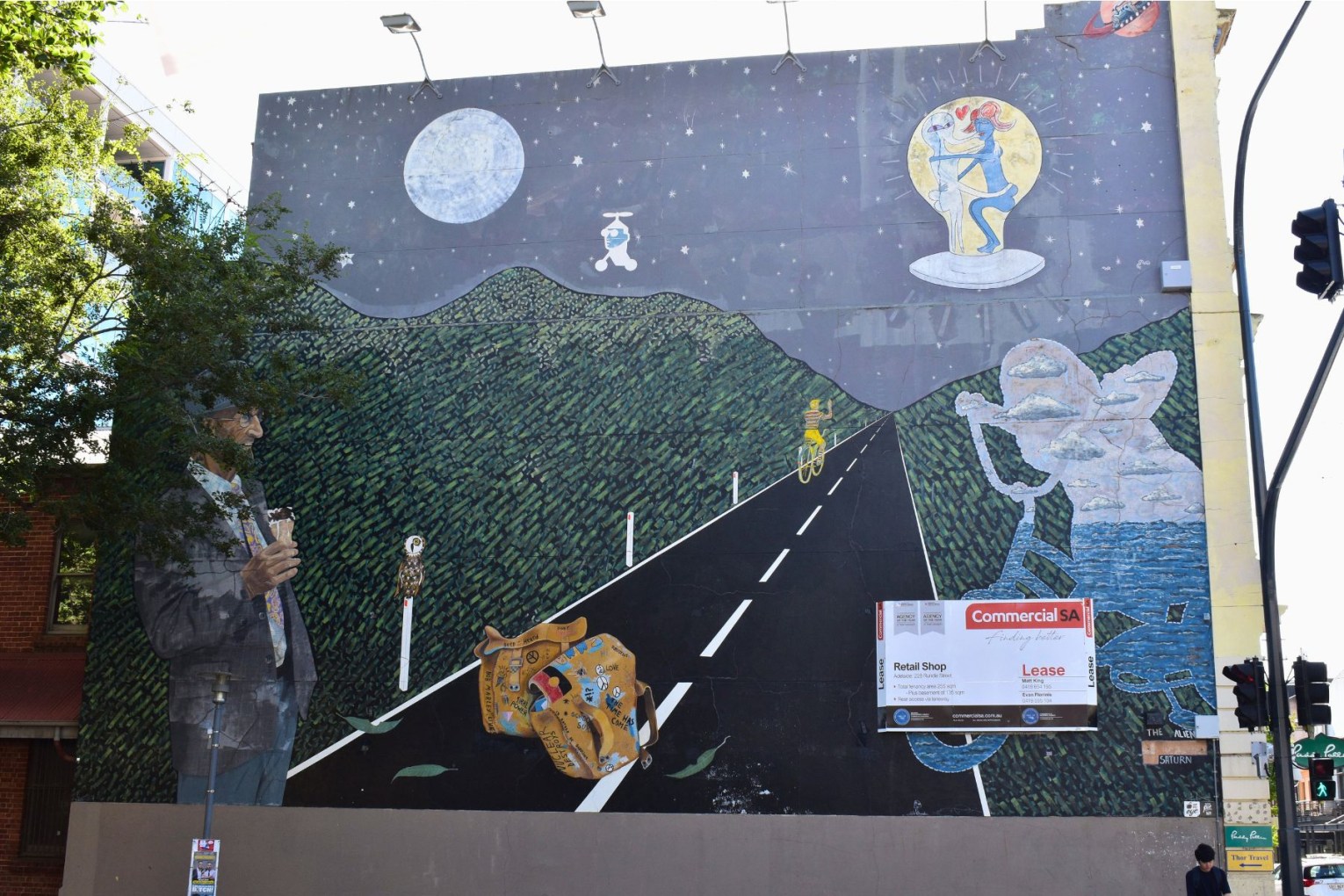 A for lease sign has been displayed on top of a mural on the corner on Frome Street and Rundle Street. This picture: Helen Karakulak/CityMag