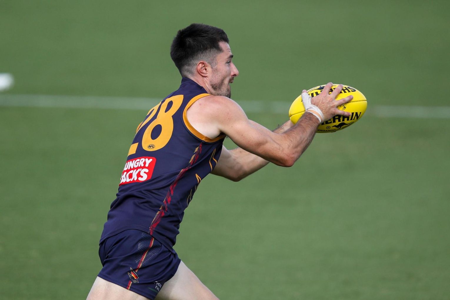 Alex Neal-Bullen is yet to make his official debut for the Adelaide Crows, seen here during an AFL match simulation against Port Adelaide last week. Image: Matt Turner/AAP