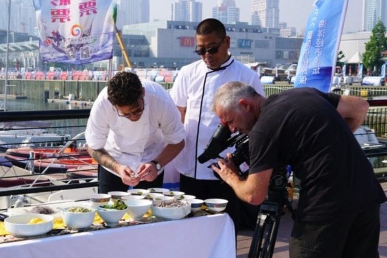 The late Jock Zonfrillo and Chinese chef Qu Jianmin filming "Chef Exchange".