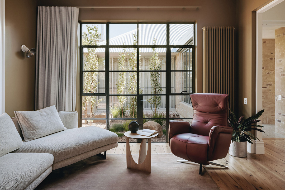 The Lego and whiskey room looks out to a central courtyard, ushering in greenery and light.