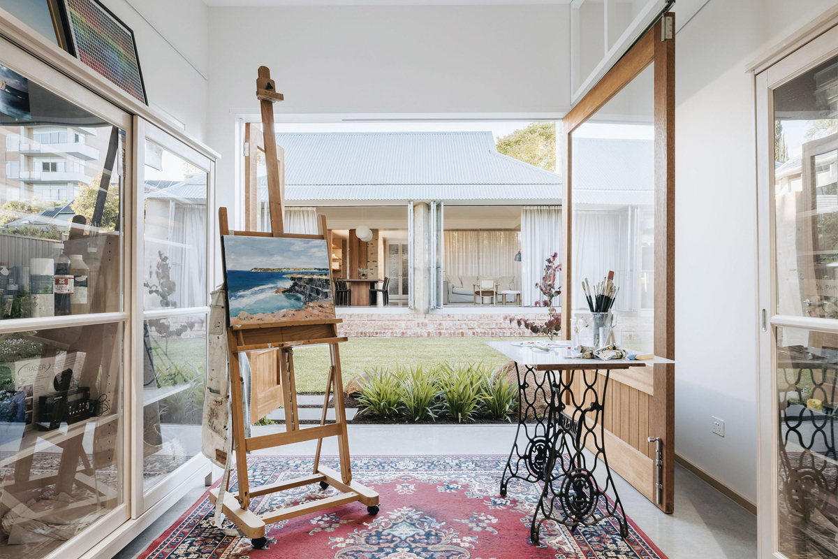 Janet's studio is a place of calm and creativity, with a door that pivots open and closed, to allow for both maximum view and space.