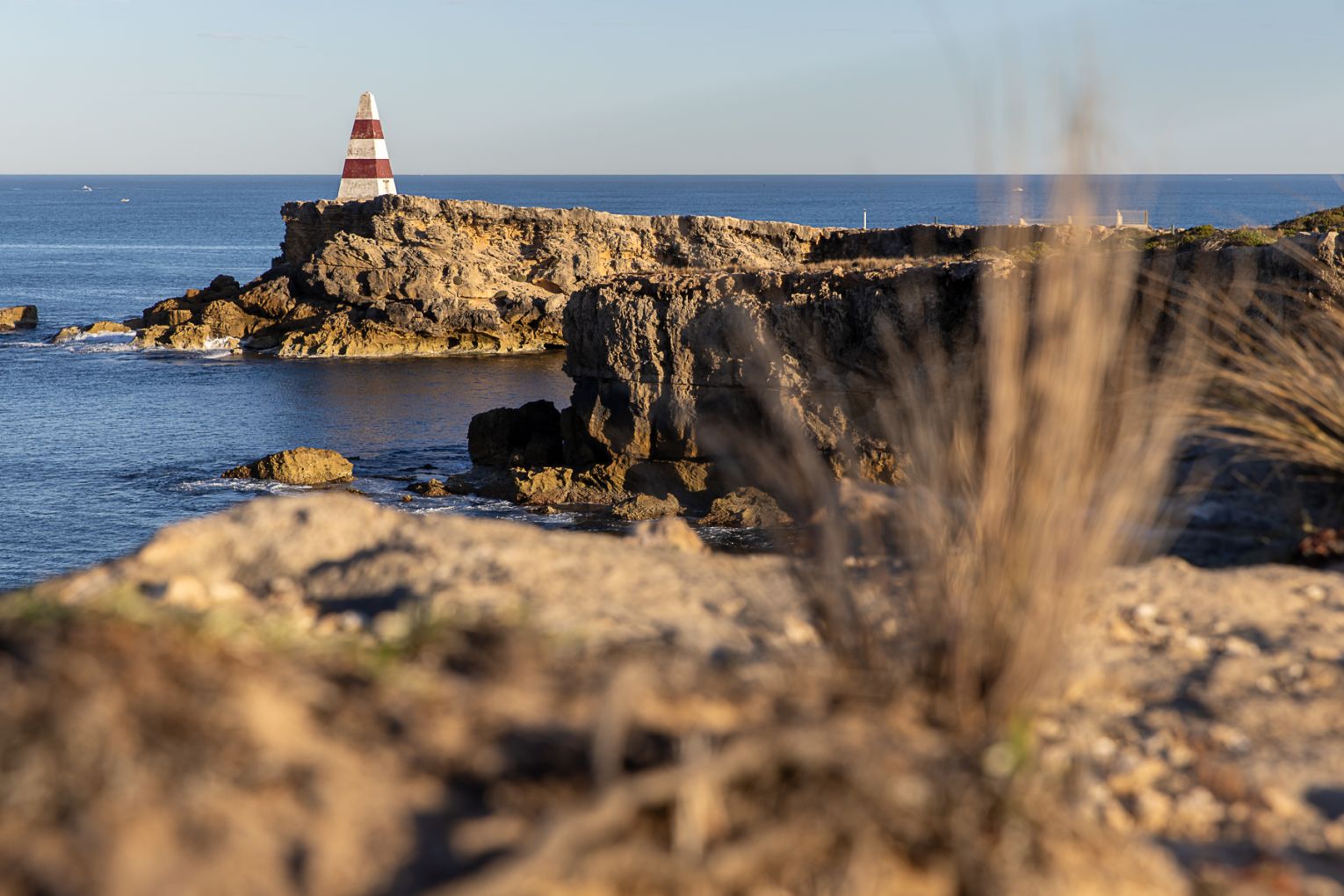Early morning sun hits the Obelisk at Robe. Photo: Ben Kelly.