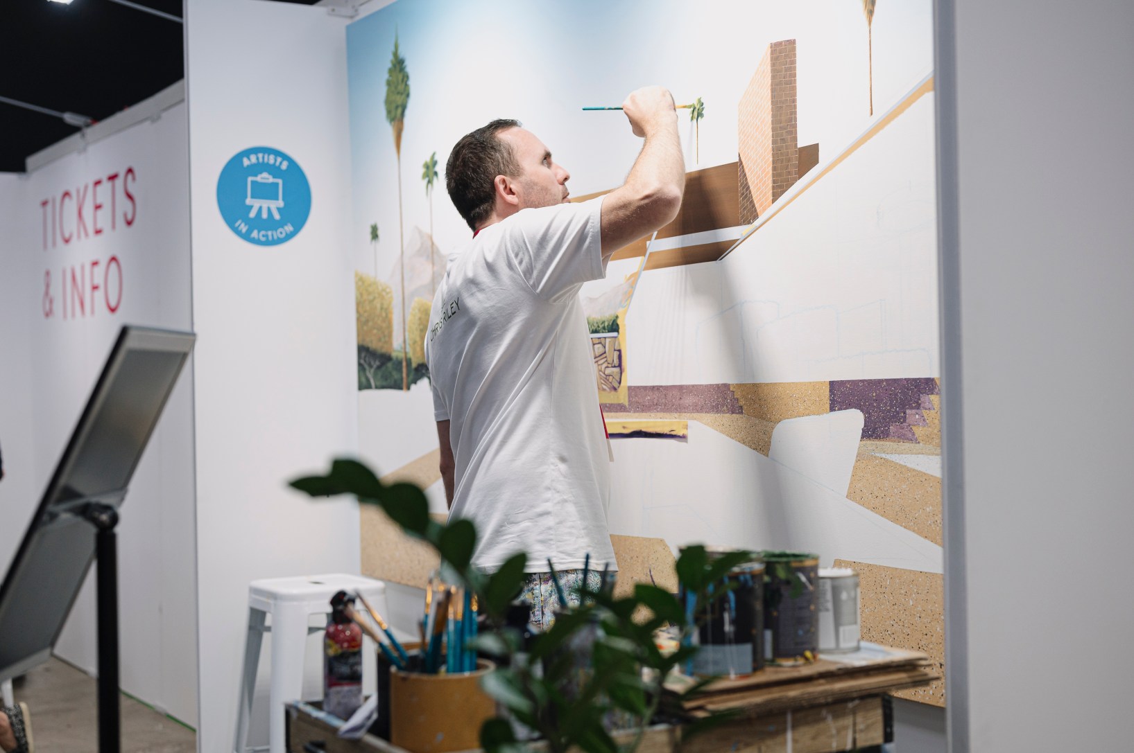 Artist Chris Riley painting a mural at the 2024 Affordable Art Fair, Brisbane. Photo: Kit Edwards
