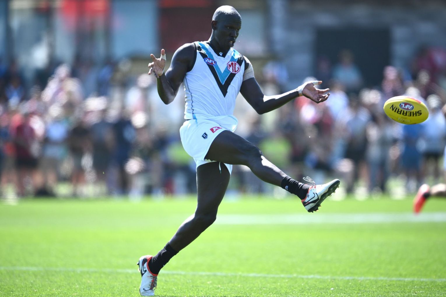 Port Adelaide player Aliir Aliir allegedly had a paper banner thrown at him by a Sydney fan on Sunday afternoon's game at the SCG. Photo: AAP Image/Joel Carrett.