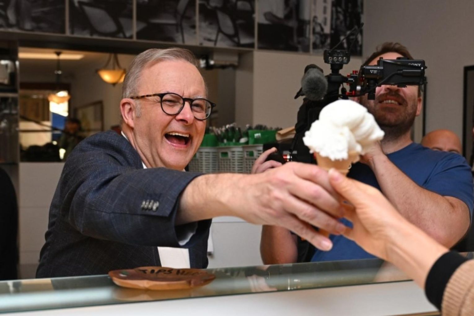 Albanese's first stop after his election win was to a coffee shop he visited with his mum. Image: AAP
