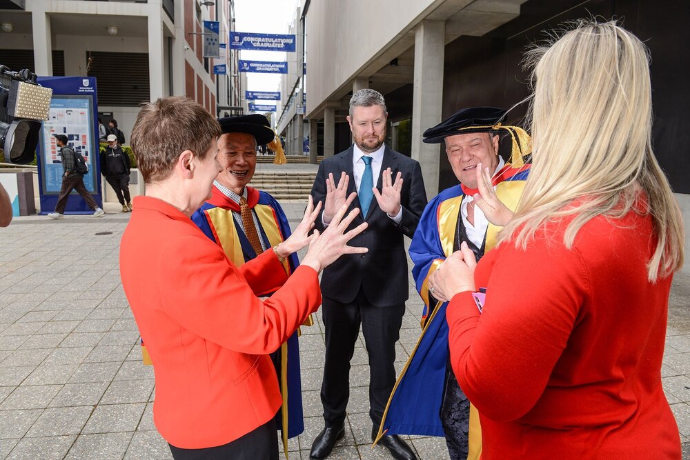 The working class man is taught a Valcun salute. Photo: Supplied