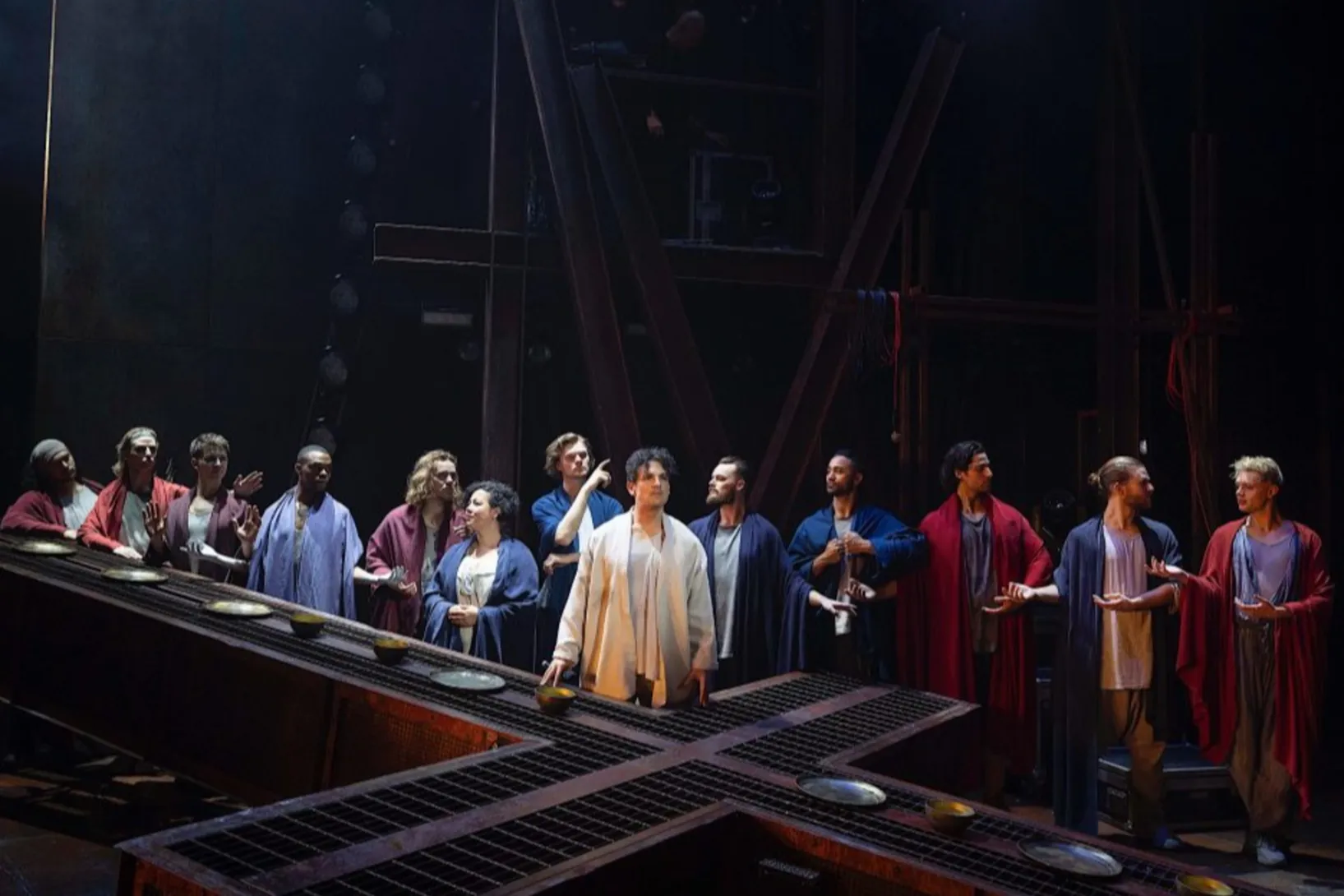Michael Paynter, pictured centre, with ensemble cast, in the titular role of Jesus in a new production of Jesus Christ Superstar.