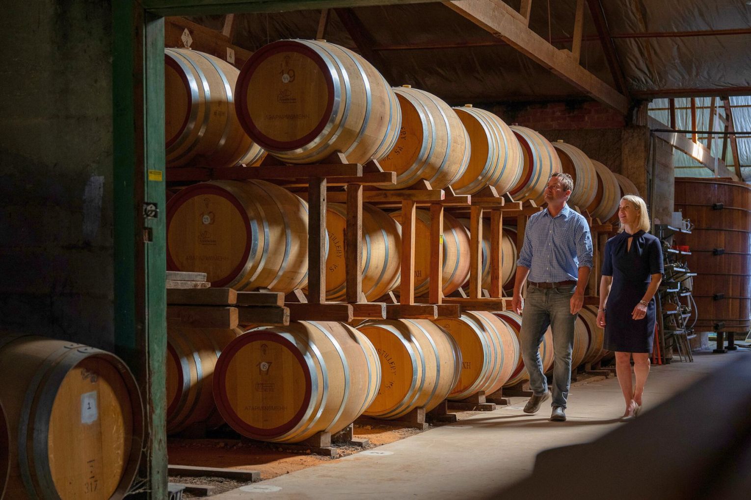 St Agnes co-managing directors Richard and Victoria Angove in the historic barrel shed. Photo: Supplied