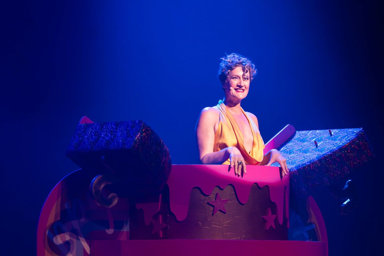 Artistic director Virginia Gay emerges from a birthday cake at the Adelaide Cabaret Festival Variety Gala. Photo: Naomi Jellicoe / Supplied