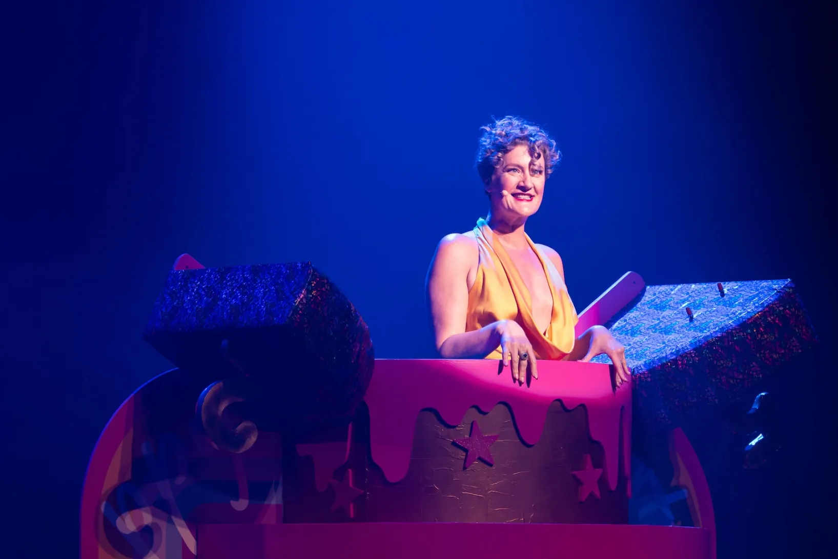 Artistic director Virginia Gay emerges from a birthday cake at the Adelaide Cabaret Festival Variety Gala. Photo: Naomi Jellicoe / Supplied