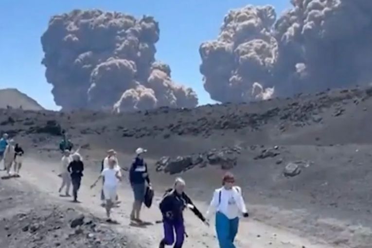 Thumbnail for Tourists run for their lives as Etna erupts 