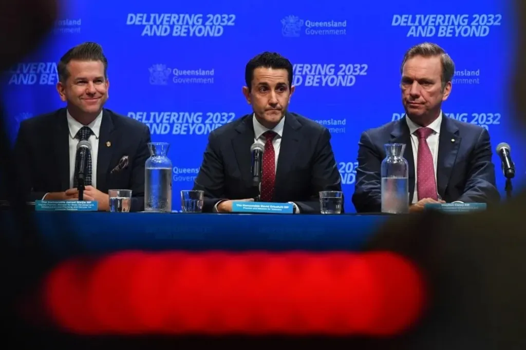David Crisafulli's (centre) government has an eye on the Olympics as it hands down its first budget. 