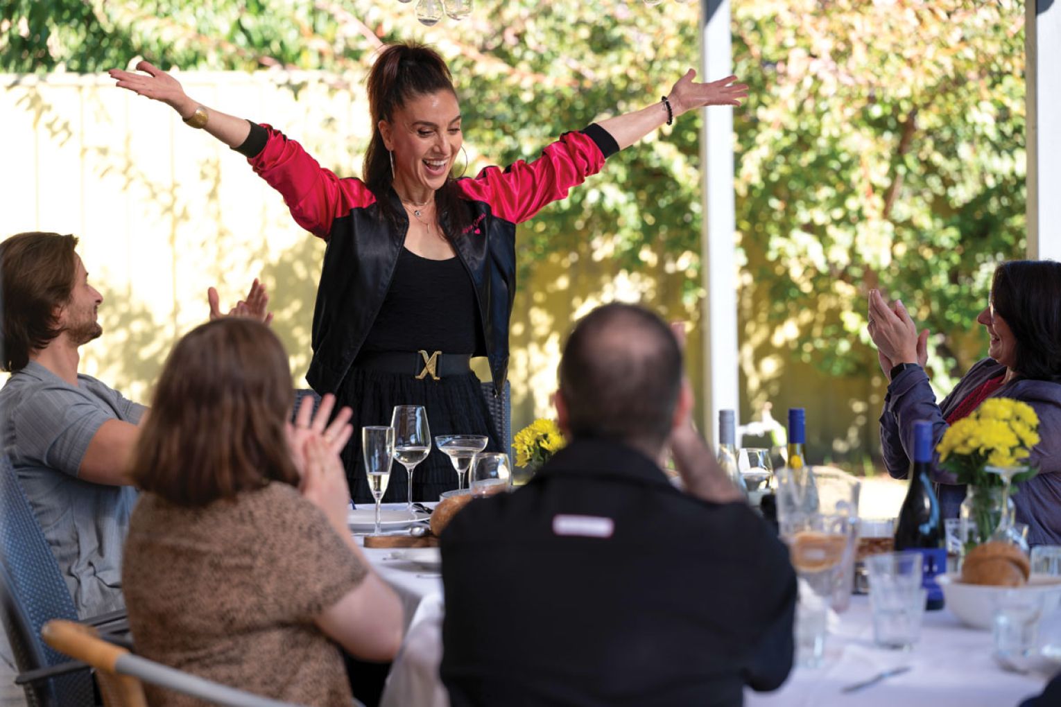 Elena welcomes her guests with open arms.