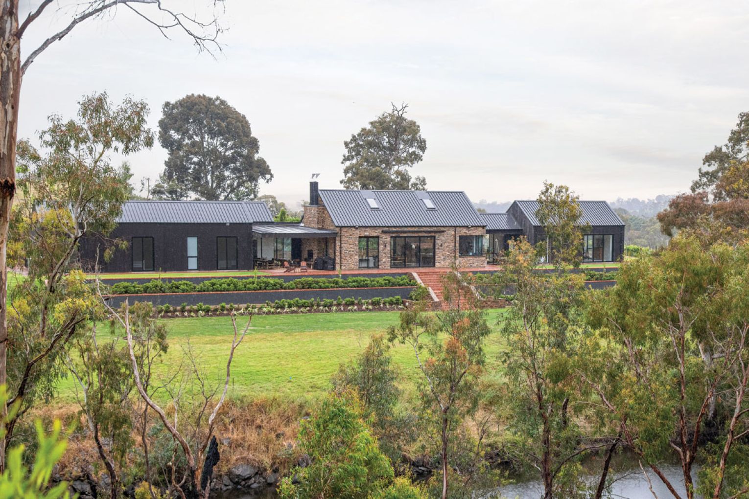 The house was designed in pods with the master suite on the right, the kitchen and living spaces in the middle and the guest wing on the left.