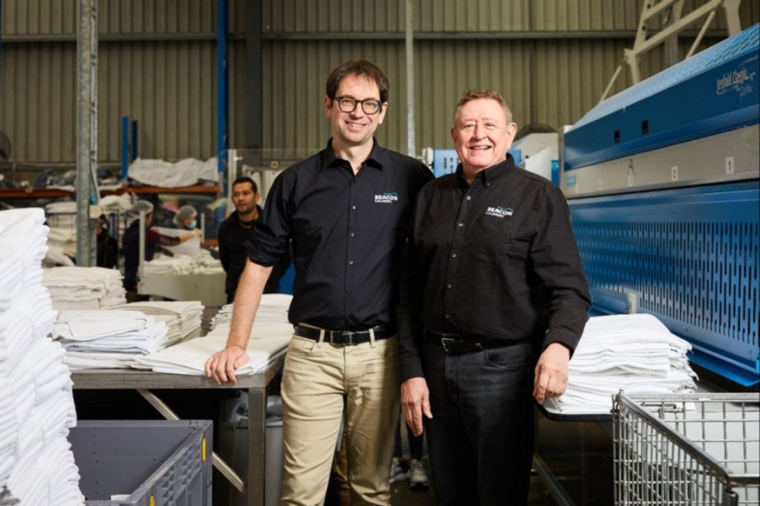 Luke Terry and Bedford Group CEO Myron Mann at Beacon Laundry, a Bedford-backed social enterprise. Photo: Supplied