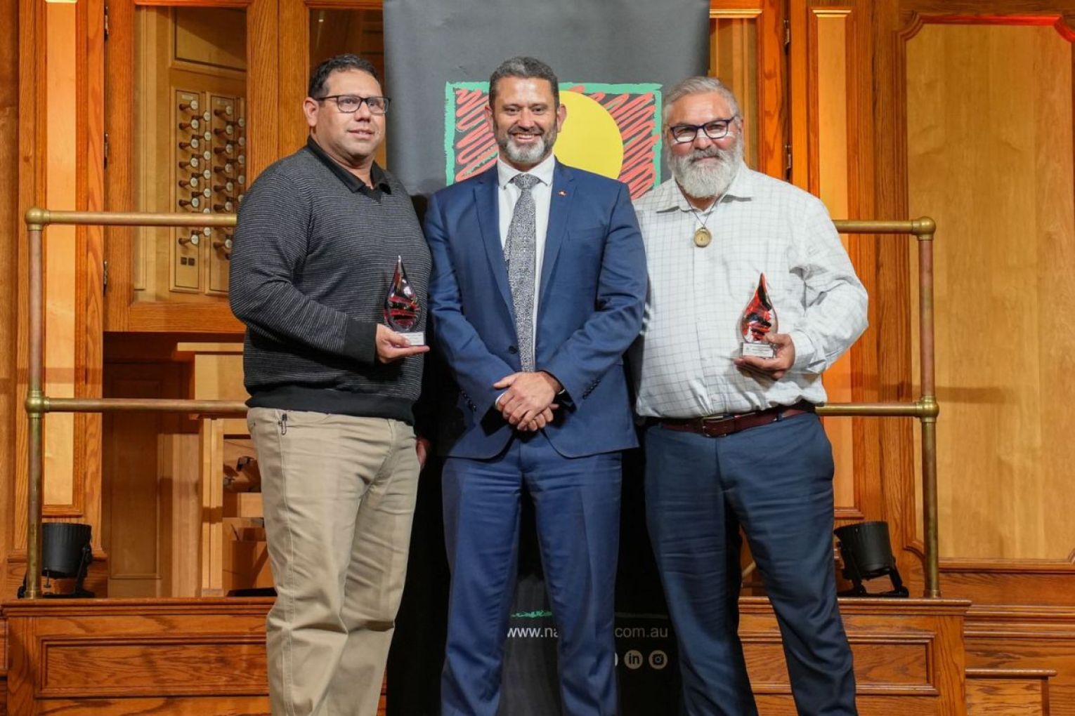 Aaron Zammit, Mgr Aboriginal Programs accepting on behalf of Josephine Kunde, with Kyam Maher and Michael OBrien at the NAIDOC award ceremony on Monday. Photo: supplied. 