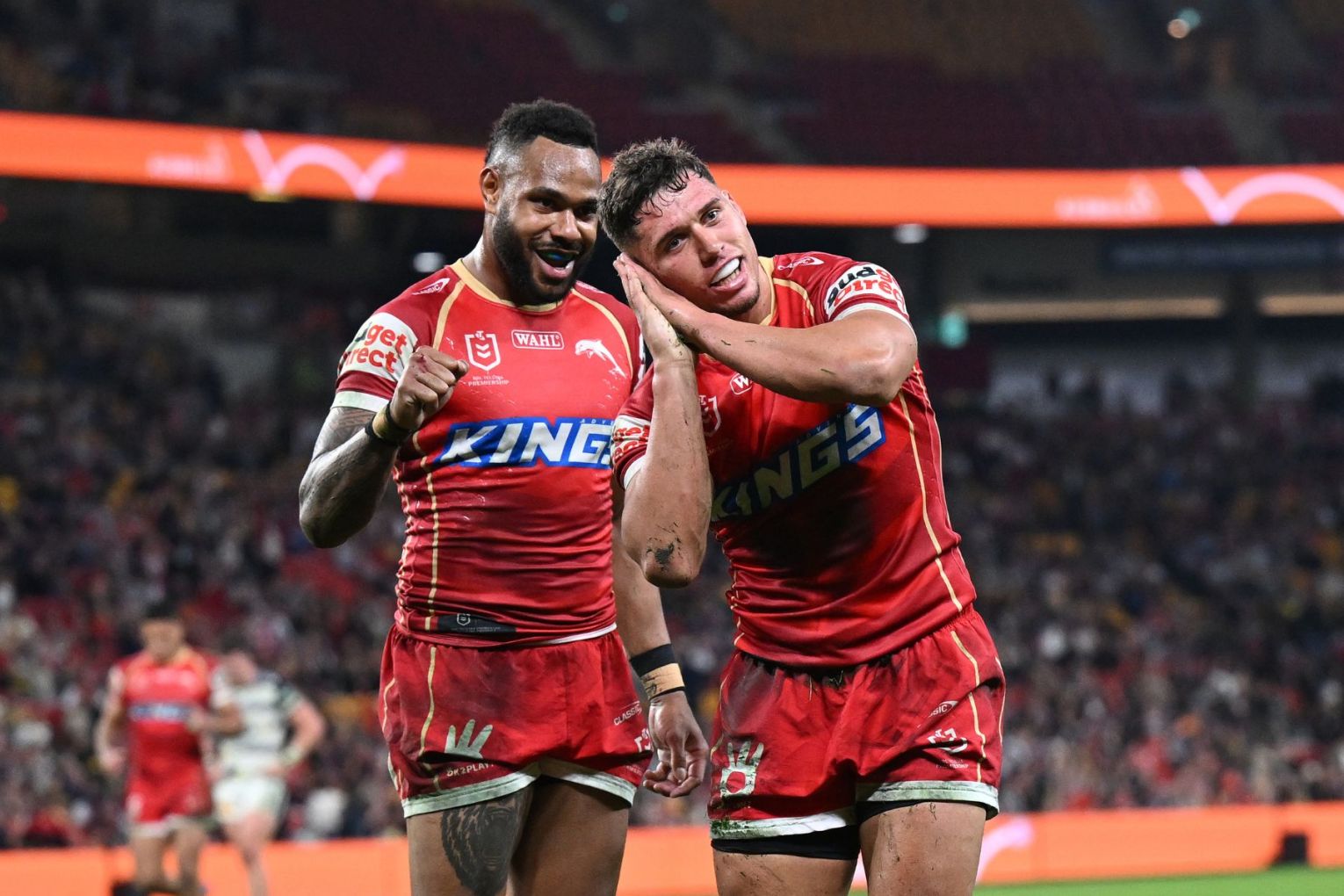 Jake Averillo of the Dolphins puts the game to bed, reacting after scoring the Dolphins final try during the NRL Round 20 match between the Dolphins and the North Queensland Cowboys at Suncorp Stadium in Brisbane on Thursday. Photo: AAP Image/Dave Hunt. 